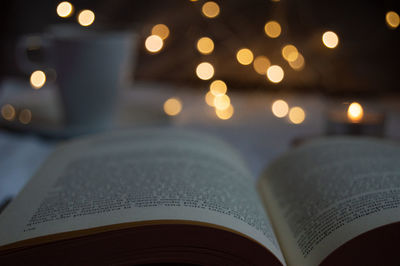 Close-up of illuminated books on table
