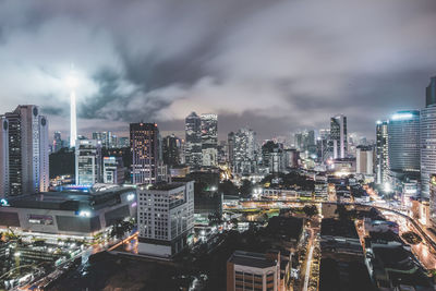 Cityscape against cloudy sky