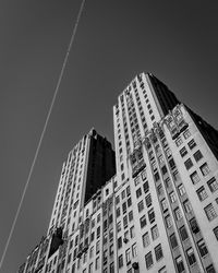 Low angle view of buildings against clear sky