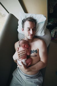 Portrait of young man at home