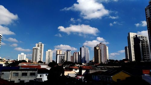 Buildings in city against sky