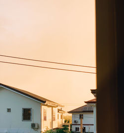 Buildings against sky during sunset