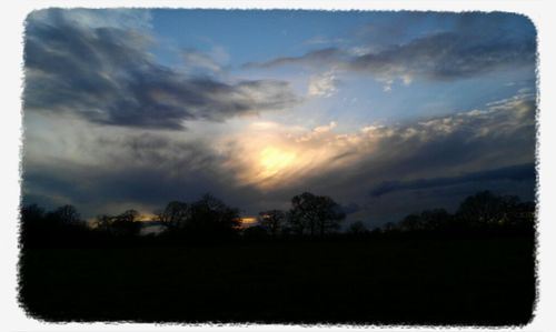 Scenic view of landscape against cloudy sky