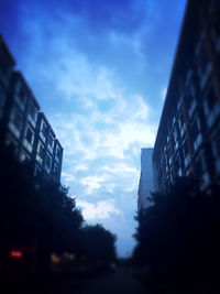 Low angle view of building against cloudy sky