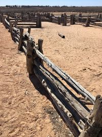 High angle view of abandoned wooden posts on beach