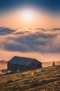 Scenic view of field against sky during sunset