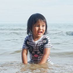 Portrait of cute boy on beach