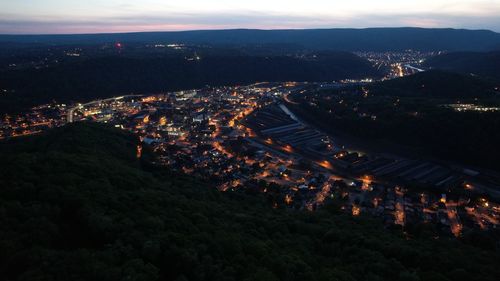 High angle view of illuminated buildings in city at night