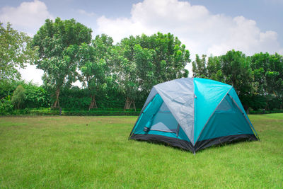 Tent in field against sky