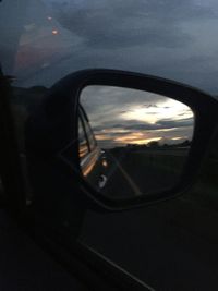 Reflection of car on side-view mirror