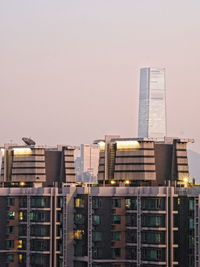Modern buildings against clear sky in city