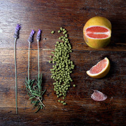 Directly above shot of food by flowers on wooden table