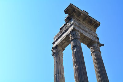 Low angle view of temple against clear blue sky