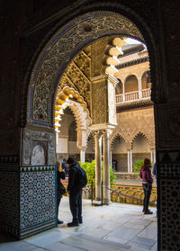 People in front of historical building