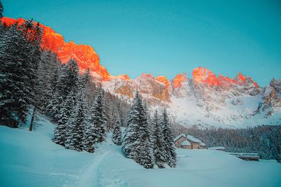 Scenic view of snow covered mountains. 