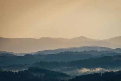 Scenic view of mountains against sky during sunset