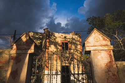 Low angle view of old building against sky