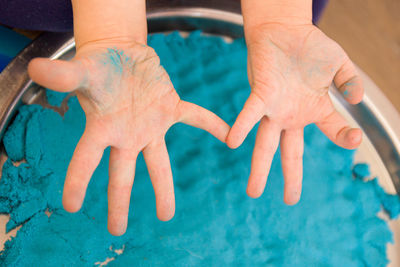 High angle view of people hands in swimming pool