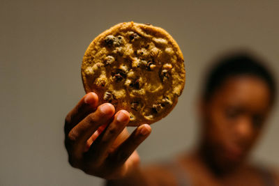 Close-up of hand holding cookie