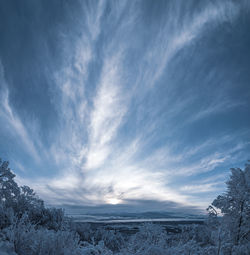 Scenic view of snowcapped landscape against sky