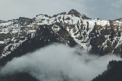 Scenic view of snowcapped mountain against sky