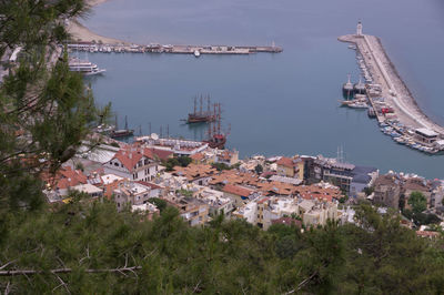 High angle view of buildings and harbor against sky