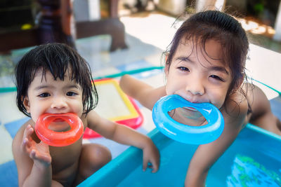 Portrait of cute girl in swimming pool