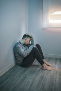 Man with problems resting sitting on the floor