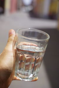 Close-up of hand holding drink