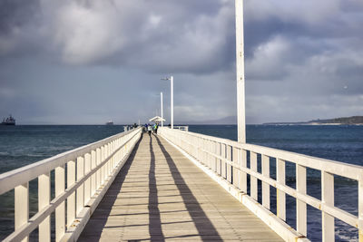 Pier over sea against sky