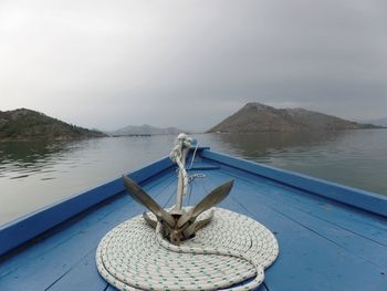 Boat in lake against sky