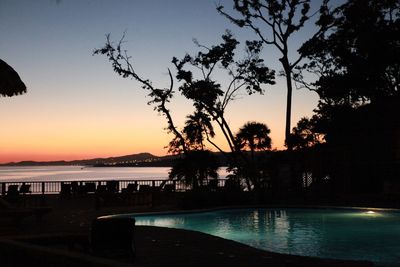Scenic view of lake at sunset