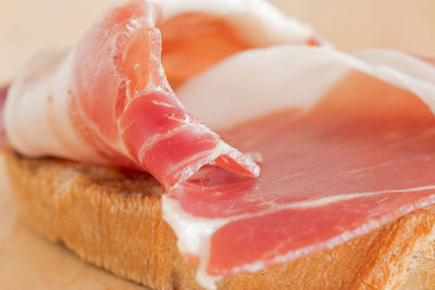 A slice of ham on a bruschetta.