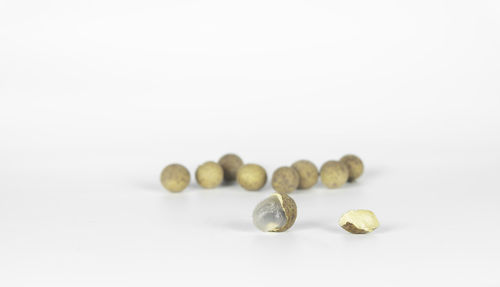 Close-up of candies against white background