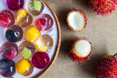 Directly above shot of fruit jelly dessert served in bowl on table