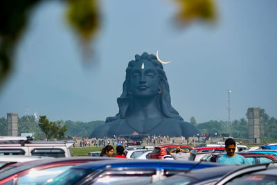 Statue of city against sky