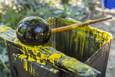 Beeswax in the process of melting into a liquid, in a metal bucket prepare for make candle.