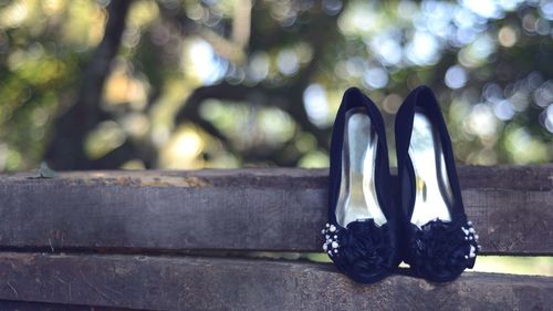 Close-up of shoes on tiled floor