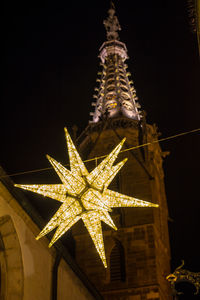 Close-up of illuminated christmas lights at night