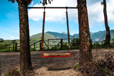 View of swing in playground against sky