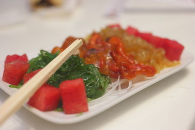 Close-up of strawberries served in plate on table