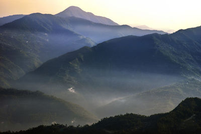 Scenic view of mountains against sky during sunset