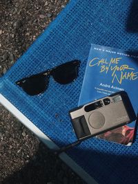 High angle view of sunglasses on chair