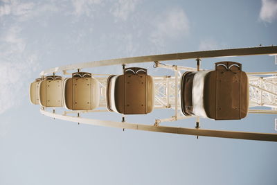 Low angle view of ferris wheel against sky