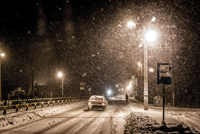 Cars on street in winter at night