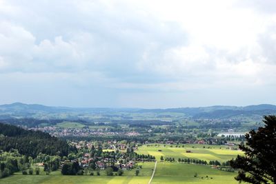 Scenic view of mountains against cloudy sky