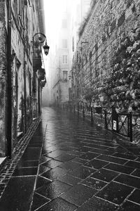 Walkway amidst buildings