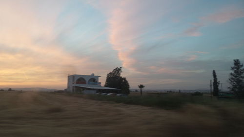 Scenic view of landscape against cloudy sky