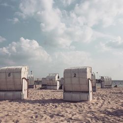 Lifeguard hut on beach against sky