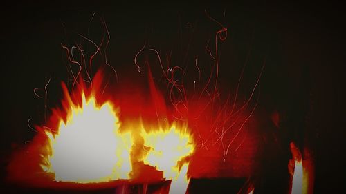 Close-up of illuminated fire at night